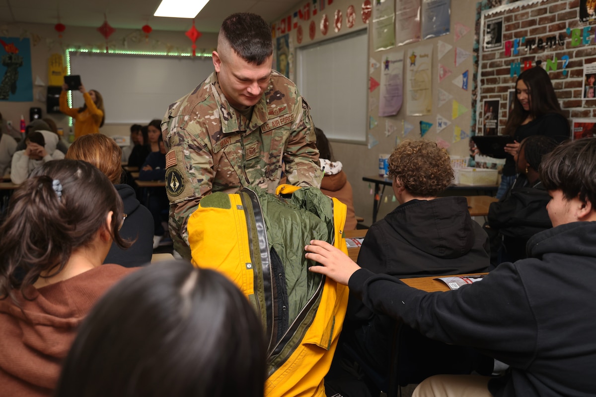 U.S. Air Force Tech. Sgt. Jeffrey Grant, 9th Physiological Support Squadron NCO in charge of U-2 operations, presents the U-2 Dragon Lady full pressure suit to 8th grade students, Feb. 3, 2023, at Anna McKinney Intermediate School, Marysville, Calif.