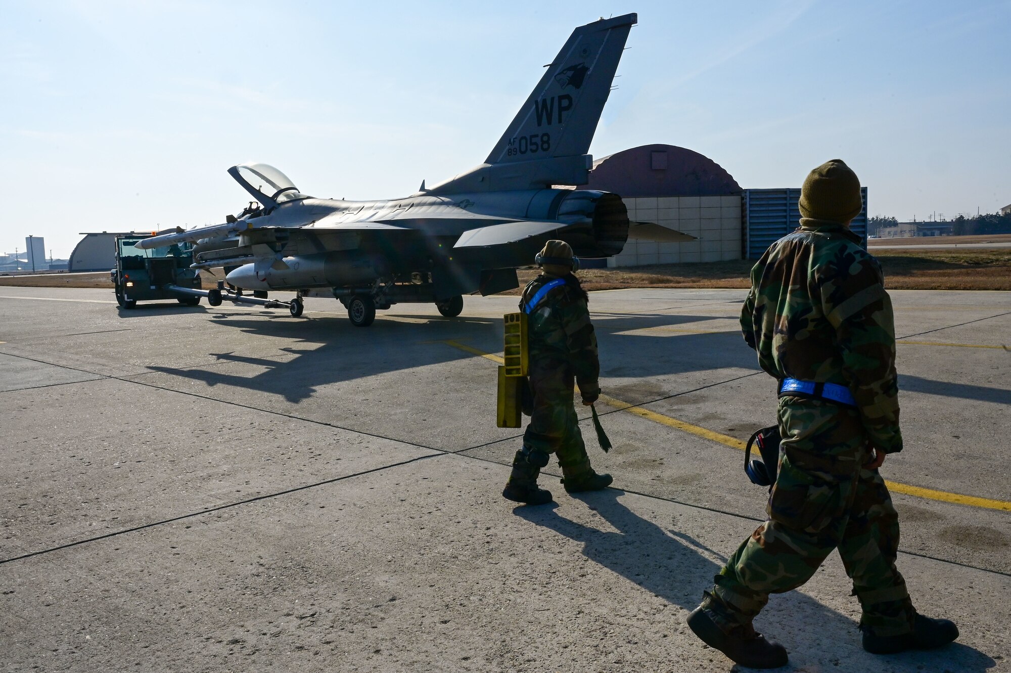 U.S. Air Force Airman 1st Class Katelyn Chavez, 35th Fighter Generation Squadron (FGS) weapons load crew member (left), and Staff Sgt. Markanthony Pace, 35th FGS weapons load crew chief, conduct rapid response cross utilization training with an F-16 Fighting Falcon after a sortie, during a training event on Kunsan Air Base, Republic of Korea, Feb. 8, 2023. The 35th Fighter Squadron, which is supported by the 35th FGS, flew around-the-clock operations alongside the 80th Fighter Squadron and the Republic of Korea Air Force’s 38th Fighter Group. (U.S. Air Force photo by Tech. Sgt. Timothy Dischinat)