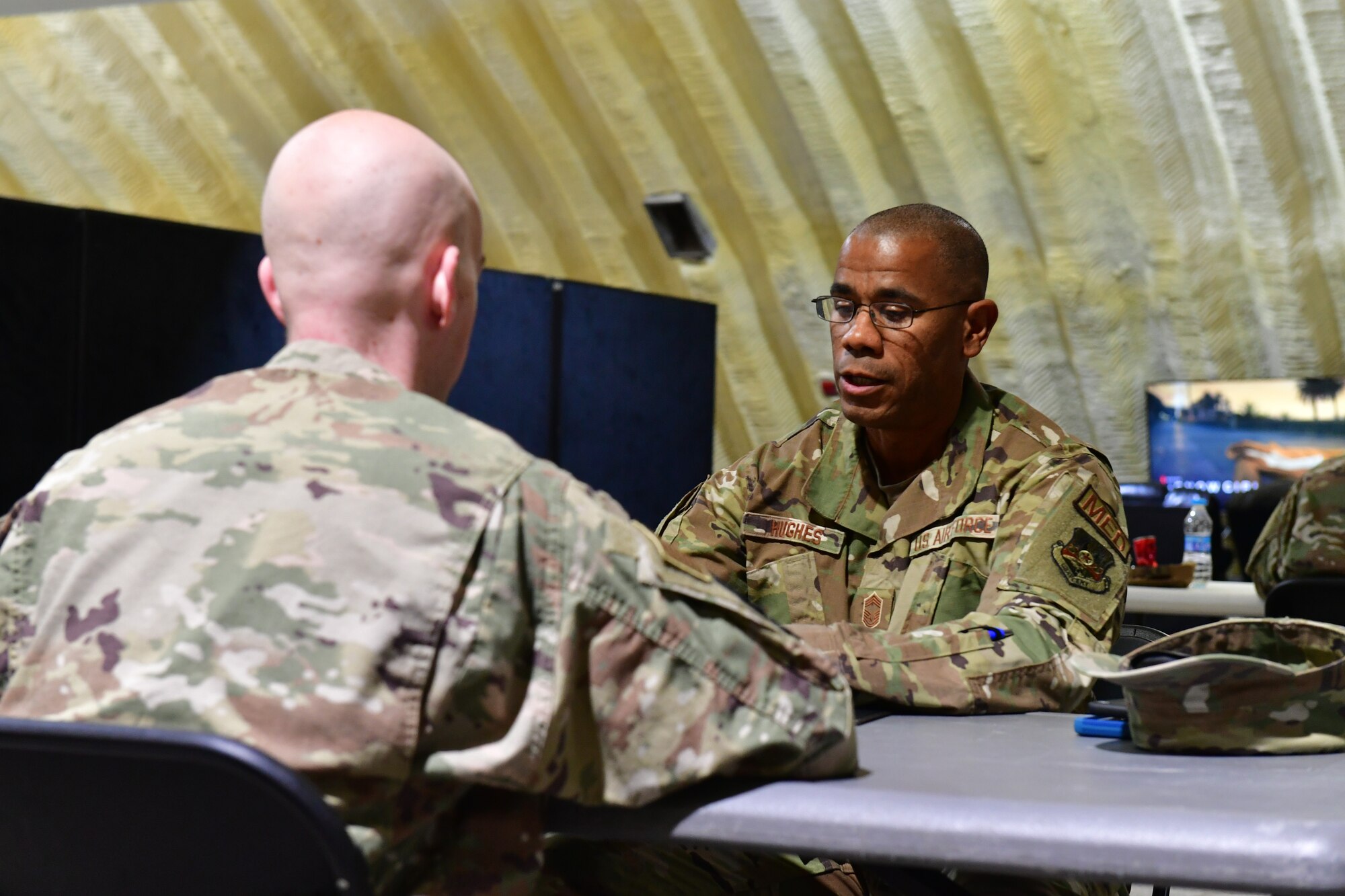 Airmen from across the 332d Air Expeditionary Wing gathered for a speed mentoring event on January 26, 2023 at an undisclosed location in Southwest Asia. Speed mentoring gives junior enlisted Airmen and non-commissioned officers a chance to engage in short question- and -answer rounds with multiple sSenior NCOs in order gain wisdom and guidance from more experienced individuals. Built on the premise of speed dating, after a few minutes, a verbal signal is given and everyone moves to the next presenter, giving participants several varied perspectives to answer their personal and career oriented questions.