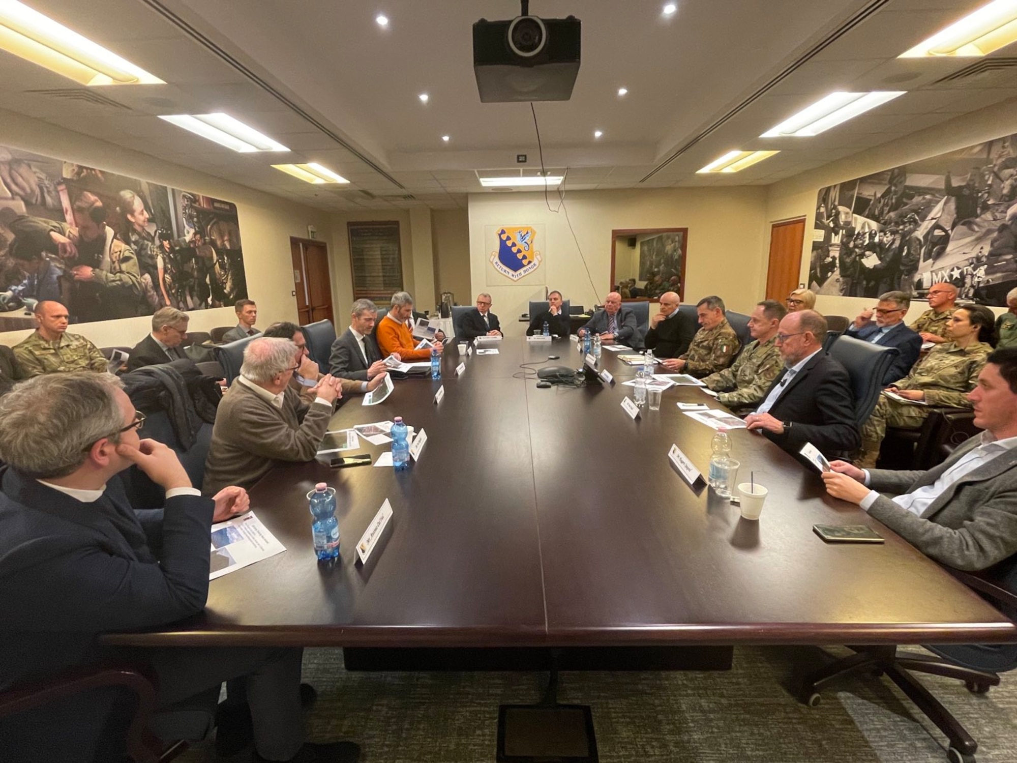 U.S. Air Force Brig. Gen. Tad Clark, 31st Fighter Wing commander, speaks with local mayors from the surrounding towns at Aviano Air Base