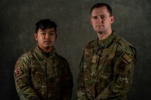 U.S. Air Force Staff Sgt. Nicholas Thompson, 5th Security Forces Squadron (SFS) response team leader (right), and Airman 1st Class Cedric Amorato, 5th SFS defender, pose for a portrait at Minot Air Force Base, North Dakota, Feb. 2, 2023. Security Forces specialists go through extensive training in law enforcement and combat tactics to protect bases both stateside and overseas. (U.S. Air Force photo by Airman 1st Class Alexander Nottingham)