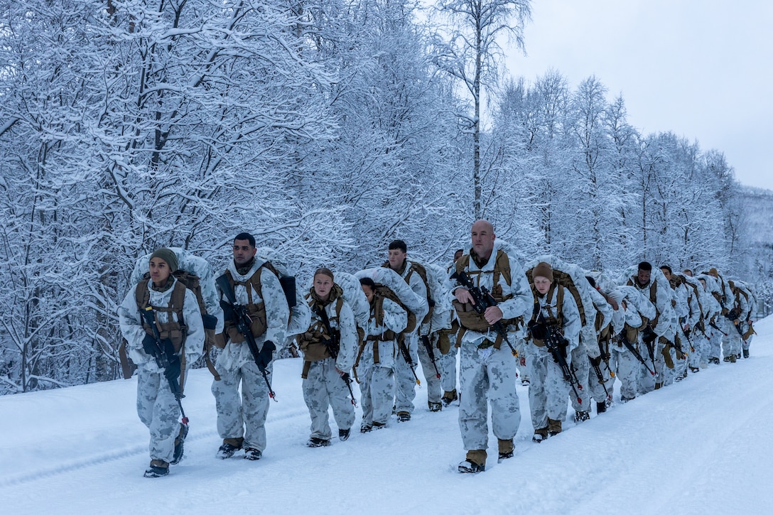 U.S. Marines with Combat Logistics Battalion 2, Combat Logistics Regiment 2, 2nd Marine Logistics Group, conduct a 5-kilometer hike during Marine Rotational Force- Europe 23.1 in Setermoen, Norway, Jan. 29, 2023. MRF-E 23.1 focuses on regional engagements throughout Europe by conducting various exercises, mountain-warfare training, and military-to-military engagements, which enhances the overall interoperability of the U.S. Marine Corps with allies and partners. (U.S. Marine Corps photo by Sgt. Christian M. Garcia)