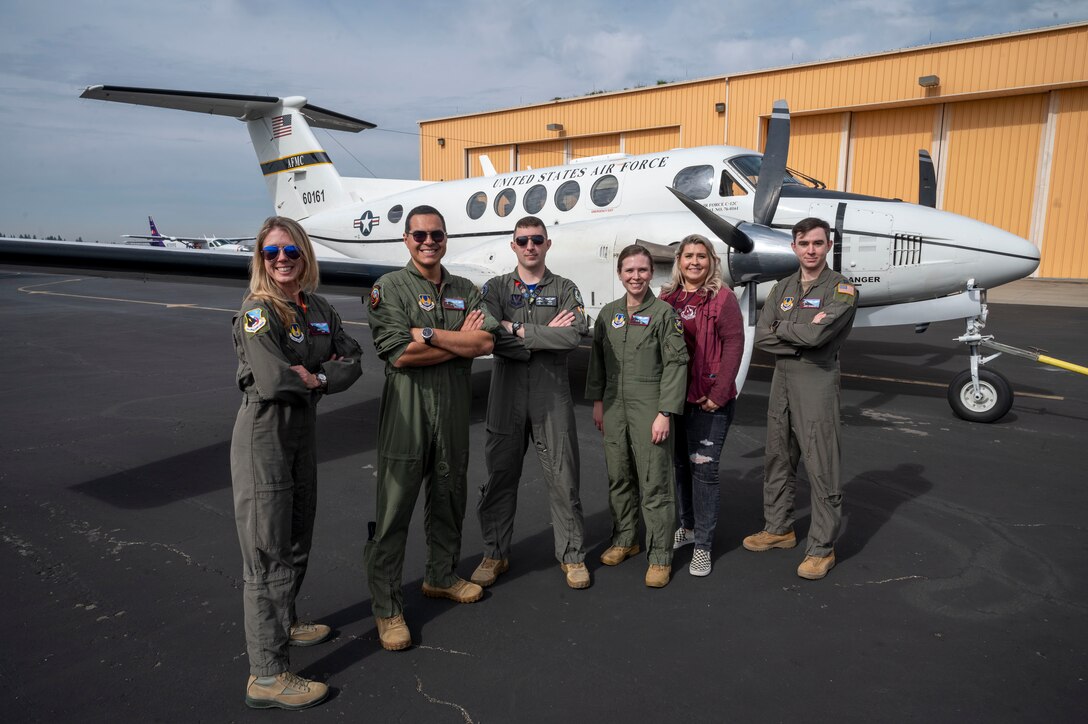Hosted by the 412th Operations Group representing Edwards Air Force Base, students visiting the California Aeronautical University Aviation Career Day in Bakersfield, California got the chance to experience being a Test Pilot and a Flight Test Engineer Feb 3. (Pictured from to right: Jessica "Sting" Peterson, Technical Director, 412th Operations Group, Lt. Col. Luis Garces, Chief of Standardization and Evaluation, 412th Operations Group, Capt. Benjamin "Vader" Kram, 31st Test and Evaluation Squadron, Lt. Col. Jessica Tompkins, Deputy Commander, 412th Operations Group, Alysha Rivera, 412th Operations Group and Capt. James Chambers, Standardization and Evaluation, 412th Operations Group.)