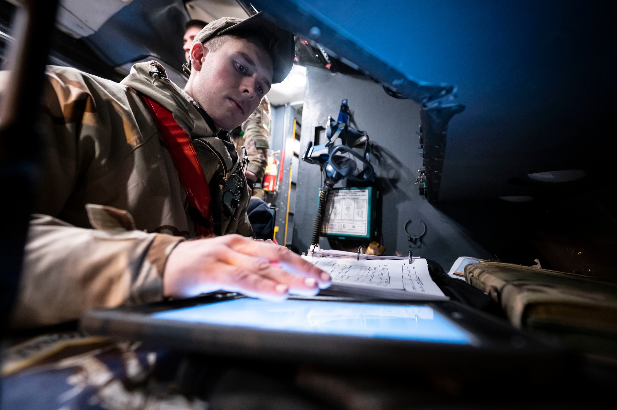 Senior Airman Daniel Baum, 436th Aircraft Maintenance Squadron crew chief, checks aircraft forms on a C-5M Super Galaxy during a 436th Mission Generation Group integration event on Dover Air Force Base, Delaware, Feb. 3, 2023. This event is part of the 436th MGG monthly readiness exercises that test the ability to perform job tasks in contested environments. (U.S. Air Force photo by Staff Sgt. Marco A. Gomez)
