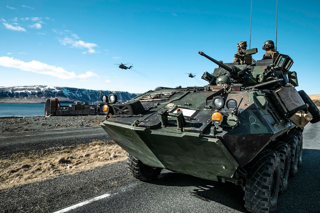 A U.S. Marine Corps Light Armored Vehicle, assigned to 22nd Marine Expeditionary Unit, executes a ship-to-shore exercise in support of Northern Viking 2022, in Miðsandur, Iceland, April 11, 2022. Northern Viking 22 strengthens interoperability and force readiness between the U.S., Iceland and Allied nations, enabling multi-domain command and control of joint and coalition forces in the defense of Iceland and Sea Lines of Communication in the Greenland, Iceland, United Kingdom (GIUK) gap. (U.S. Navy photo by Mass Communication Specialist 1st Class Tyler Thompson)