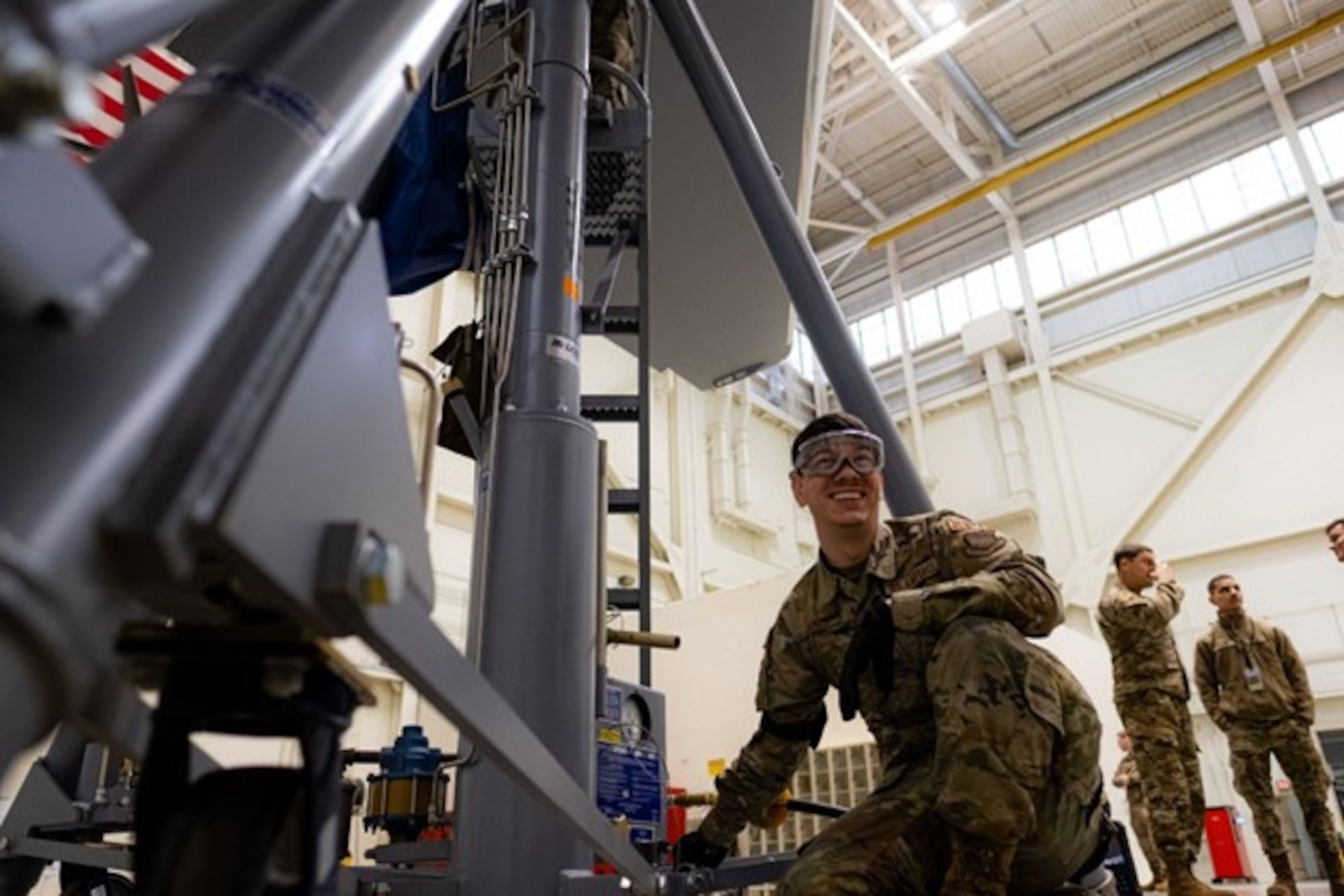 Man smiles as he operates machinery