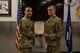 U.S. Air Force Staff Sgt. Nicholas Thompson, 5th Security Forces Squadron response team leader (right), is awarded the Air And Space Achievement Medal at Minot Air Force Base, North Dakota, Feb. 10, 2023. Thompson was awarded the medal for taking heroic action that saved a fellow Airman's life. (U.S. Air Force Photo by Airman 1st Class Alexander Nottingham)