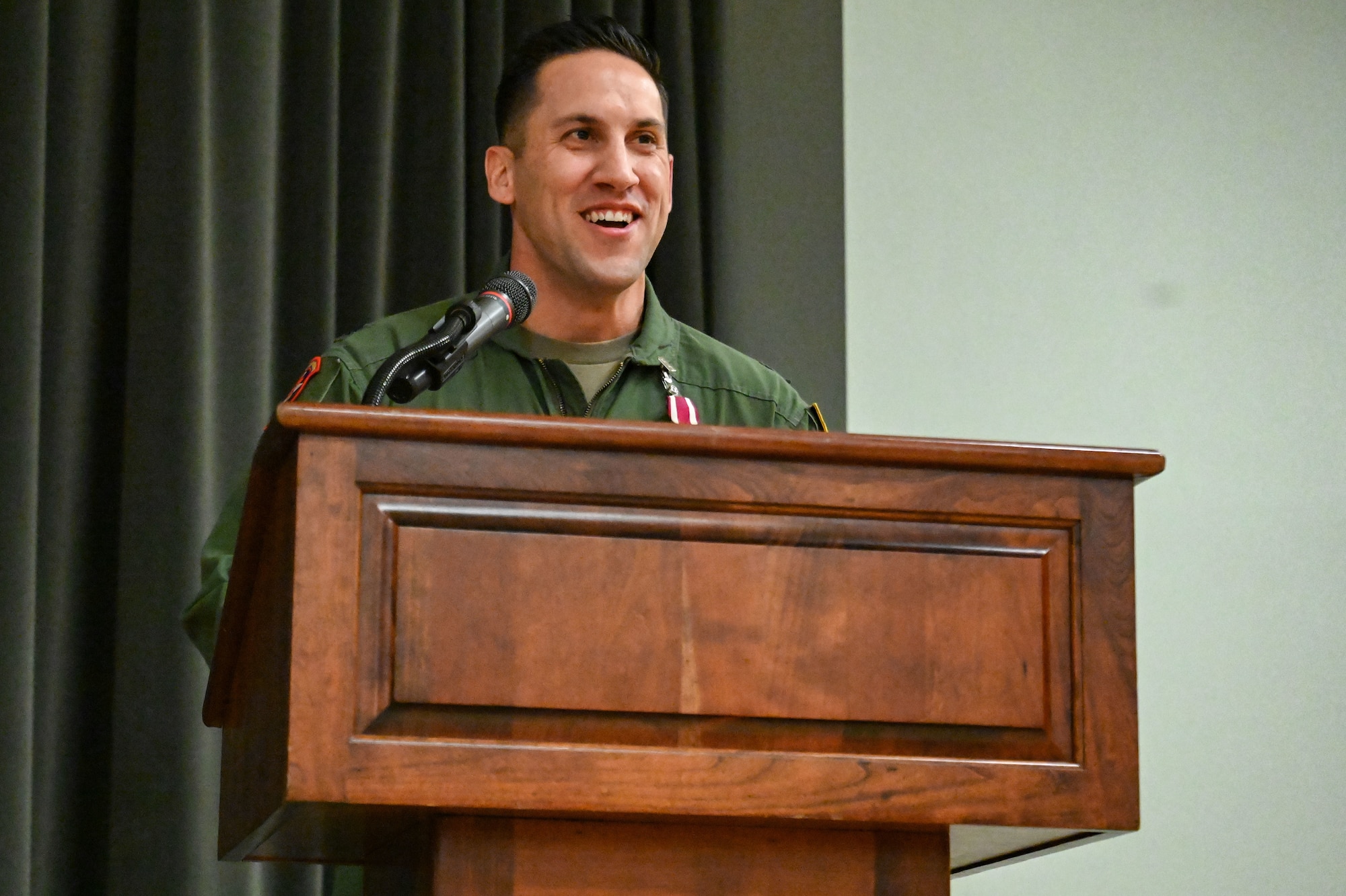 Man in uniform gives speech.