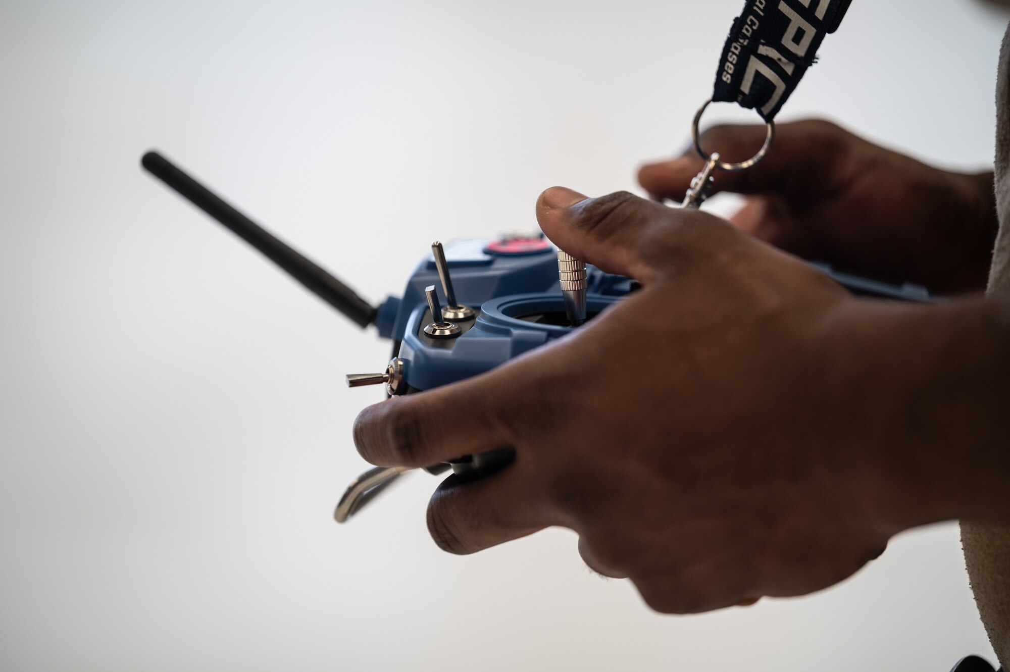 Senior Airman Lou Osagie, 15th Maintenance Squadron aircraft structural maintenance journeyman, utilizes a controller to operate a trainer drone at Joint Base Pearl Harbor-Hickam, Hawaii, Feb. 8, 2023. The five-day training was done to prepare maintainers for an innovative maintenance aircraft inspection process that will allow airmen to inspect an aircraft with a drone. (U.S. Air Force photo by Staff Sgt. Alan Ricker)