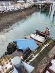 Tug vessel Tagish is partially submerged at the National Guard Dock in the vicinity of the Alaska Marine Lines yard in the Gastineau Channel, Juneau, Alaska, Dec. 29, 2022. Coast Guard Sector Juneau crew members and contractors are responding the incident. (U.S. Coast Guard photo courtesy of Sector Juneau)