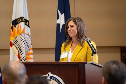 Kelly Hokanson, spouse of the chief of the National Guard Bureau, speaks at the District of Columbia Armory in Washington Feb. 9, 2023. Hokanson recognized three staff members of the District of Columbia National Guard Family Readiness Program for supporting more than 26,000 Soldiers and Airmen during the Capitol Response.