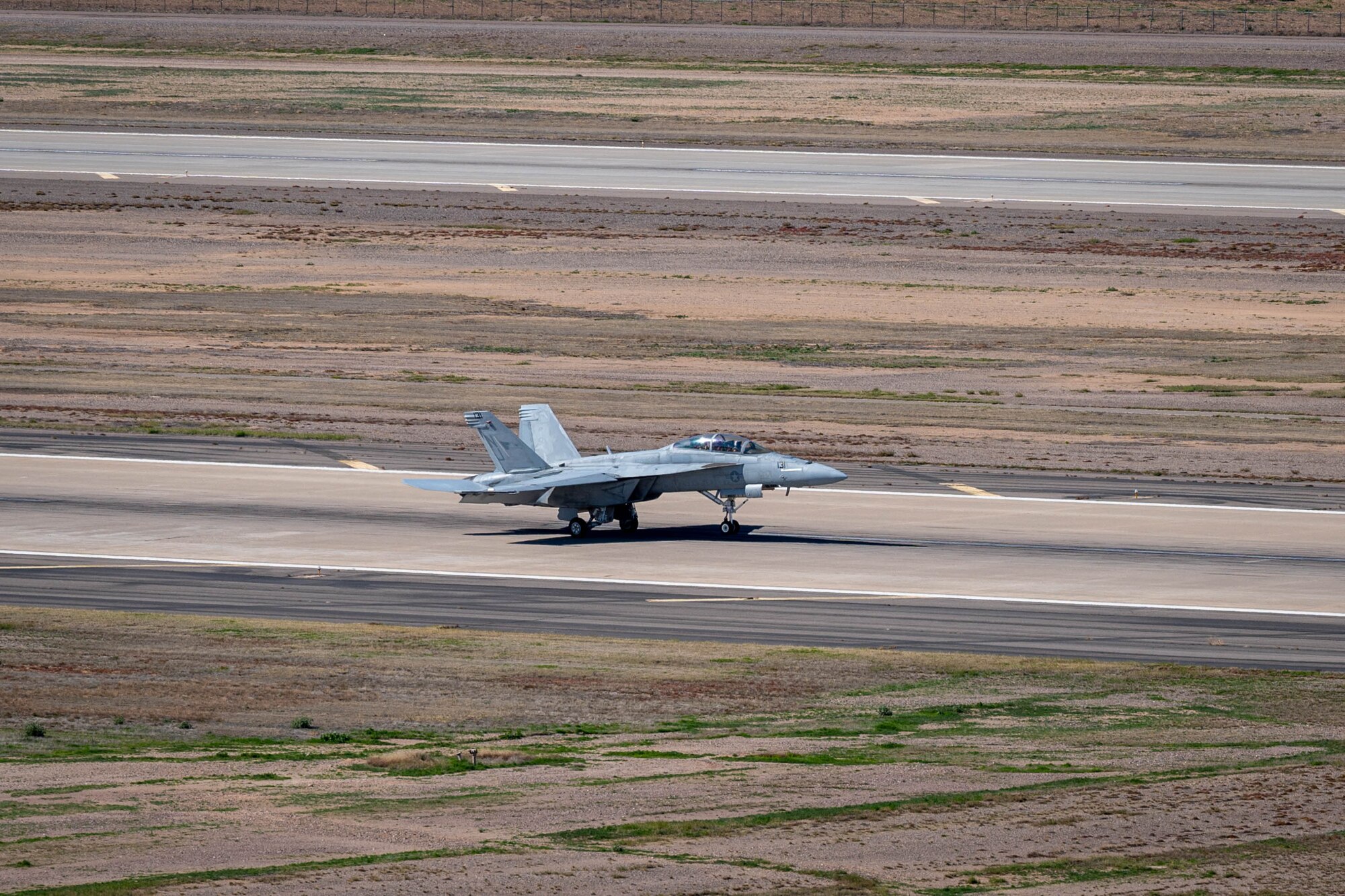 A U.S. Navy F/A-18F Super Hornet assigned to the “Flying Eagles” Strike Fighter Squadron (VFA) 122 out of Naval Air Station (NAS) Lemoore, California, lands at Luke Air Force Base, Arizona, Feb. 7, 2023.