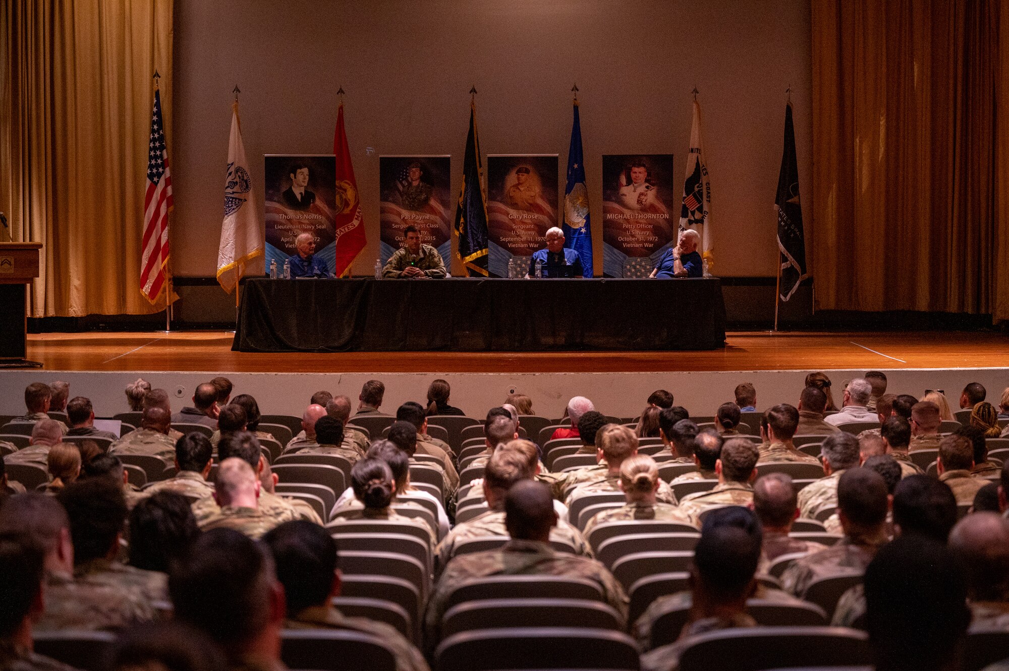 Airmen and family listen to stories from Medal of Honor recipients at a MoH panel on Feb. 10, 2023, at Luke Air Force Base, Arizona.