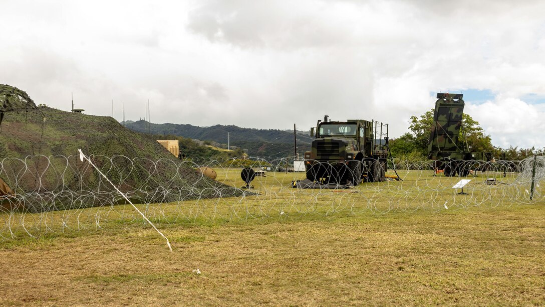 A Medium Tactical Vehicle Replacement and a Ground and Air Task Oriented Radar system are displayed at the site of an expeditionary command and control (C2) node