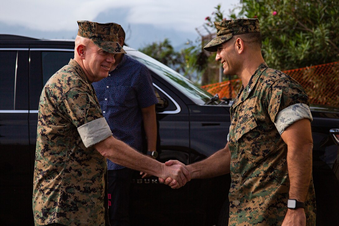 U.S. Marine Corps Gen. David H. Berger, the 38th Commandant of the Marine Corps, greets U.S. Marine Corps Col. Speros Koumparakis, commanding officer, during a visit to MCBH, Feb. 1 2023. Gen. Berger and Sgt. Maj. Troy E. Black, the 19th Sergeant Major of the Marine Corps were briefed by MCBH Leadership and staff on current and future base operations as well as environmental efforts.