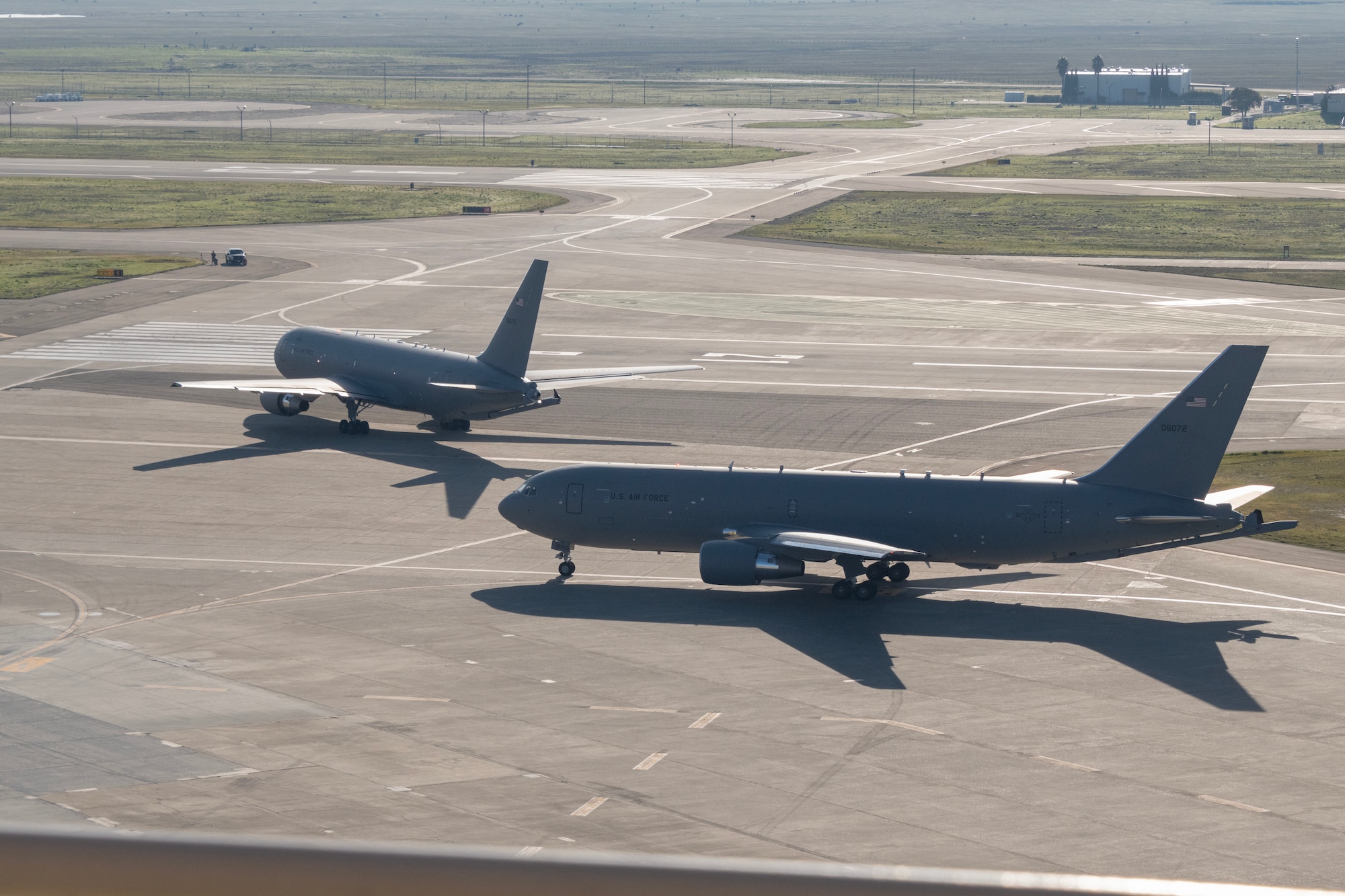 Two airplanes on the flight line.