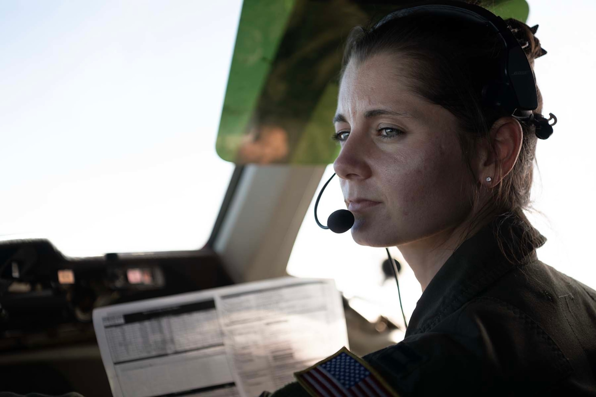 An Airman pilots an airplane.