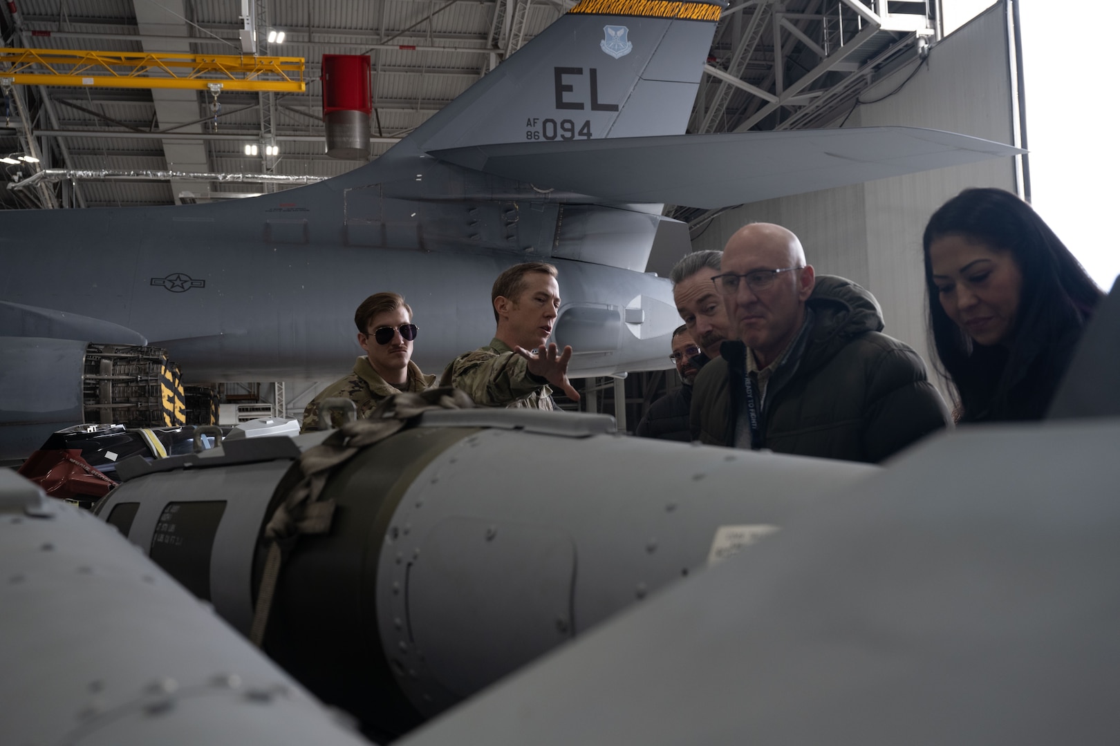 U.S. Air Force Col. Daniel Wester, 28th Bomb Wing special assistant to the commander, talks about the characteristics of the various munitions the B-1B Lancers can employ with civic leaders from the greater Cheyenne area participating in a civic leader tour at Ellsworth Air Force Base, South Dakota, Feb. 8, 2023.