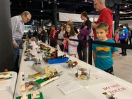 LEGO ship models of varying sizes and complexity are on display during the Hampton Roads Naval Museum’s 12th Annual Brick by Brick: LEGO Shipbuilding event at the Decker Half Moone Cruise and Celebration Center in Downtown Norfolk, Virginia. The event attracted a crowd of over 3,500 visitors who had the opportunity to create ship models with LEGO bricks, enjoy robotics demonstrations, enter LEGO shipmodel contests, enjoy crafts and free play areas and become immersed in STEM and naval history during the daylong event. The event is an annual event hosted by the museum, who partnered with The Navy League of the United States-Hampton Roads Chapter, the American Society of Naval Engineers-Tidewater Section, the First Lego League, Hampton Roads LEGO User Group, and the Naval History and Heritage Command, among others. Over 75 active duty Sailors assigned to various commands in the Hampton Roads, Virginia also volunteered during the event for a unique community relations experience.