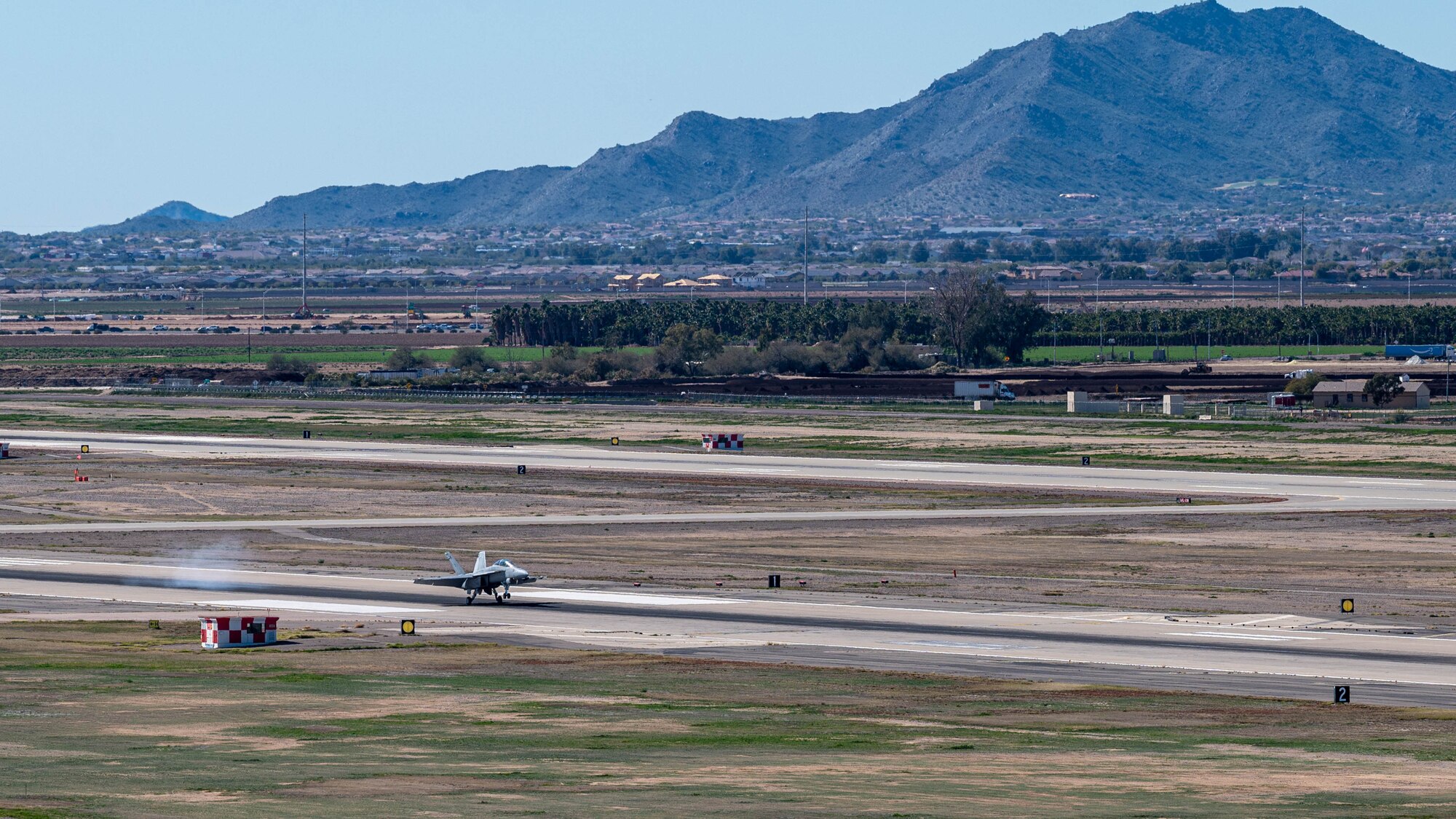 A U.S. Navy F/A-18F Super Hornet assigned to the “Flying Eagles” Strike Fighter Squadron (VFA) 122 out of Naval Air Station (NAS) Lemoore, California, lands at Luke Air Force Base, Arizona, Feb. 7, 2023.