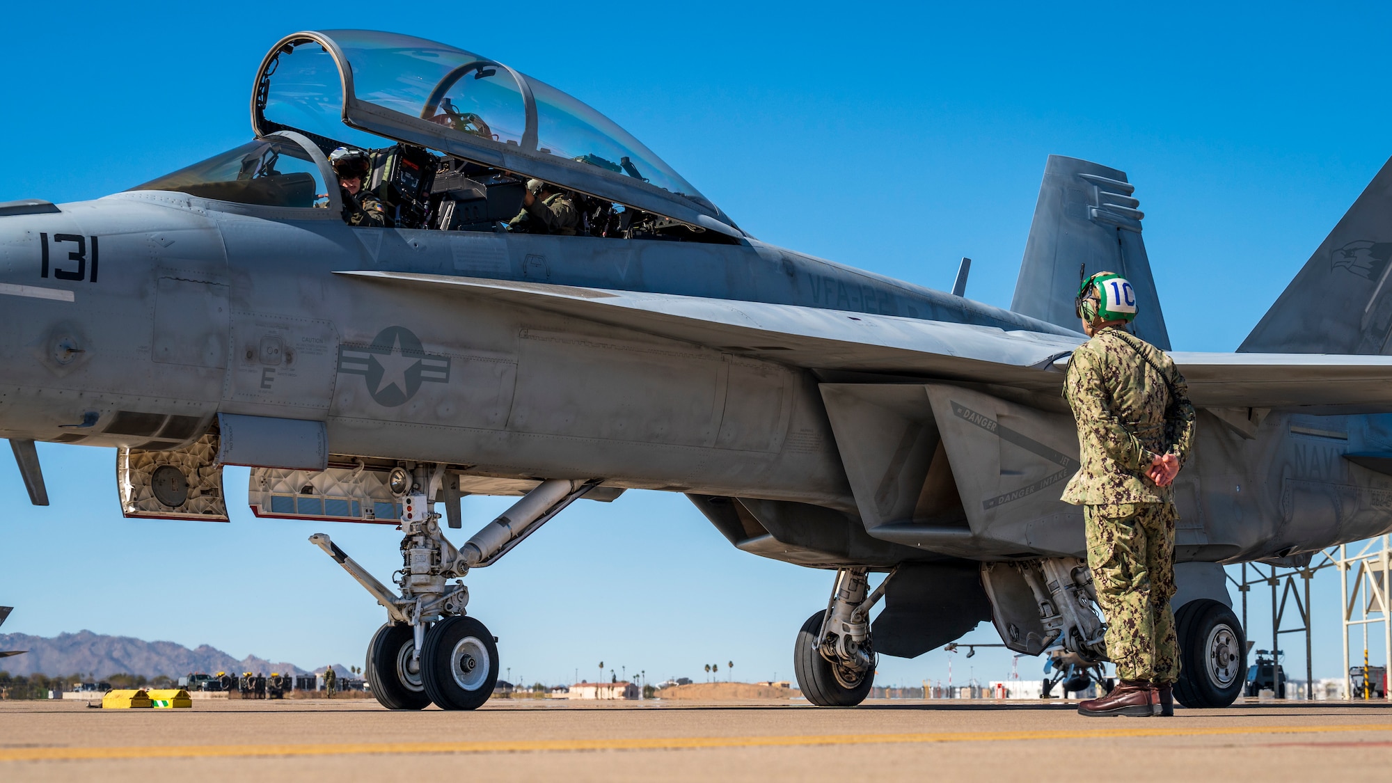U.S. Navy ADC Kevin Frey catches an F/A-18E Super Hornet assigned to the “Flying Eagles” of Strike Fighter Squadron (VFA) 122, Lemoore, California, at Luke Air Force Base, Arizona, Feb. 7, 2023.