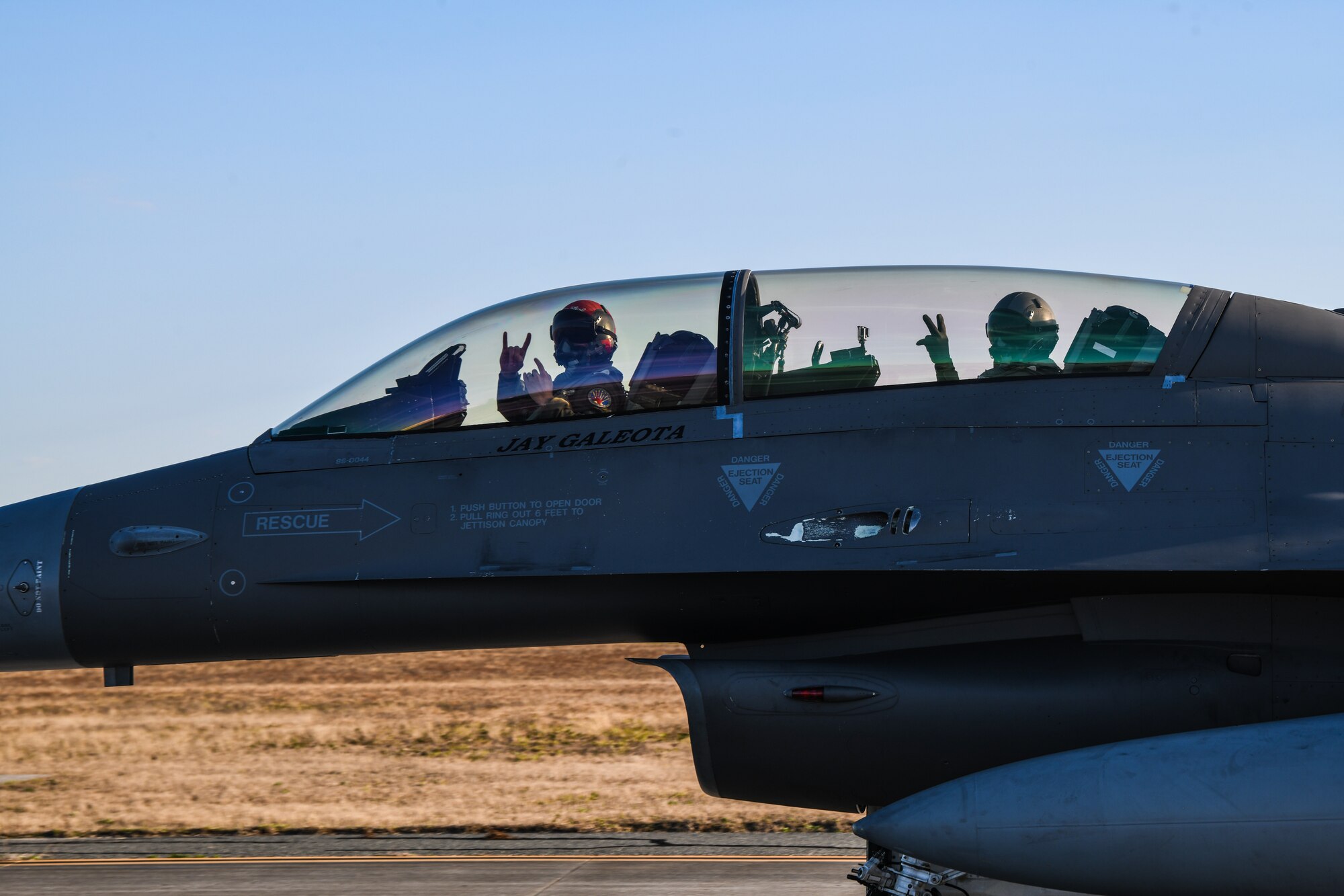 An image of a U.S. Air Force F-16 fighter pilot and his back seat passenger, both with the 177th Fighter Wing of the New Jersey Air National Guard, taxiing in preparation for an incentive flight, Jan. 24, 2023, at Tyndall Air Force Base, Fla.
