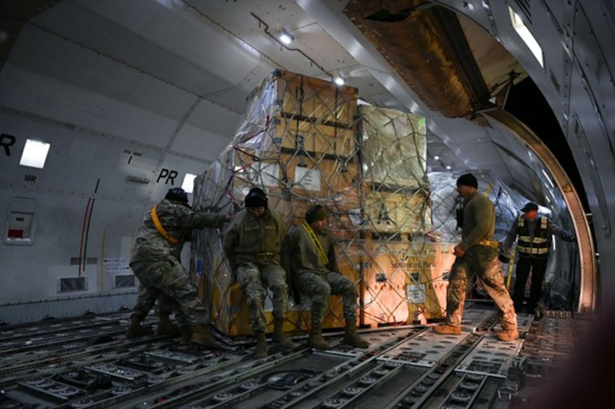 Members from the 728th Air Mobility Squadron assist humanitarian relief efforts by offloading a chartered 747-400F containing a 52-bed emergency field hospital tent from U.S. non-government organization Samaritan's Purse at Incirlik Air Base, Türkiye, Feb. 10, 2023. The hospital components will be transported commercially to Antakya, Türkiye to give aid to those in need following the earthquakes that struck Türkiye on Feb. 6. The U.S. military is working in support of U.S. Agency for International Development, the government of Türkiye and our Allies and partners to provide relief to the people of Türkiye. The 39th Air Base Wing is committed to facilitating disaster relief operations to rapidly reduce the suffering of the victims of this disaster. (U.S. Air Force photo by Staff Sgt. Gabrielle Winn)