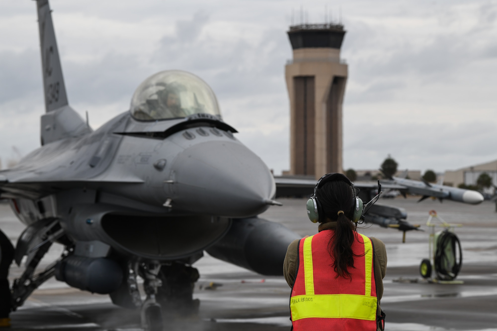 An image of U.S. Air Force Staff Sgt. Maria-Jose Ibarra, load crew chief with the 177th Fighter Wing of the New Jersey Air National Guard, marshaling an F-16C+ Fighting Falcon at Tyndall Air Force Base, Fla.