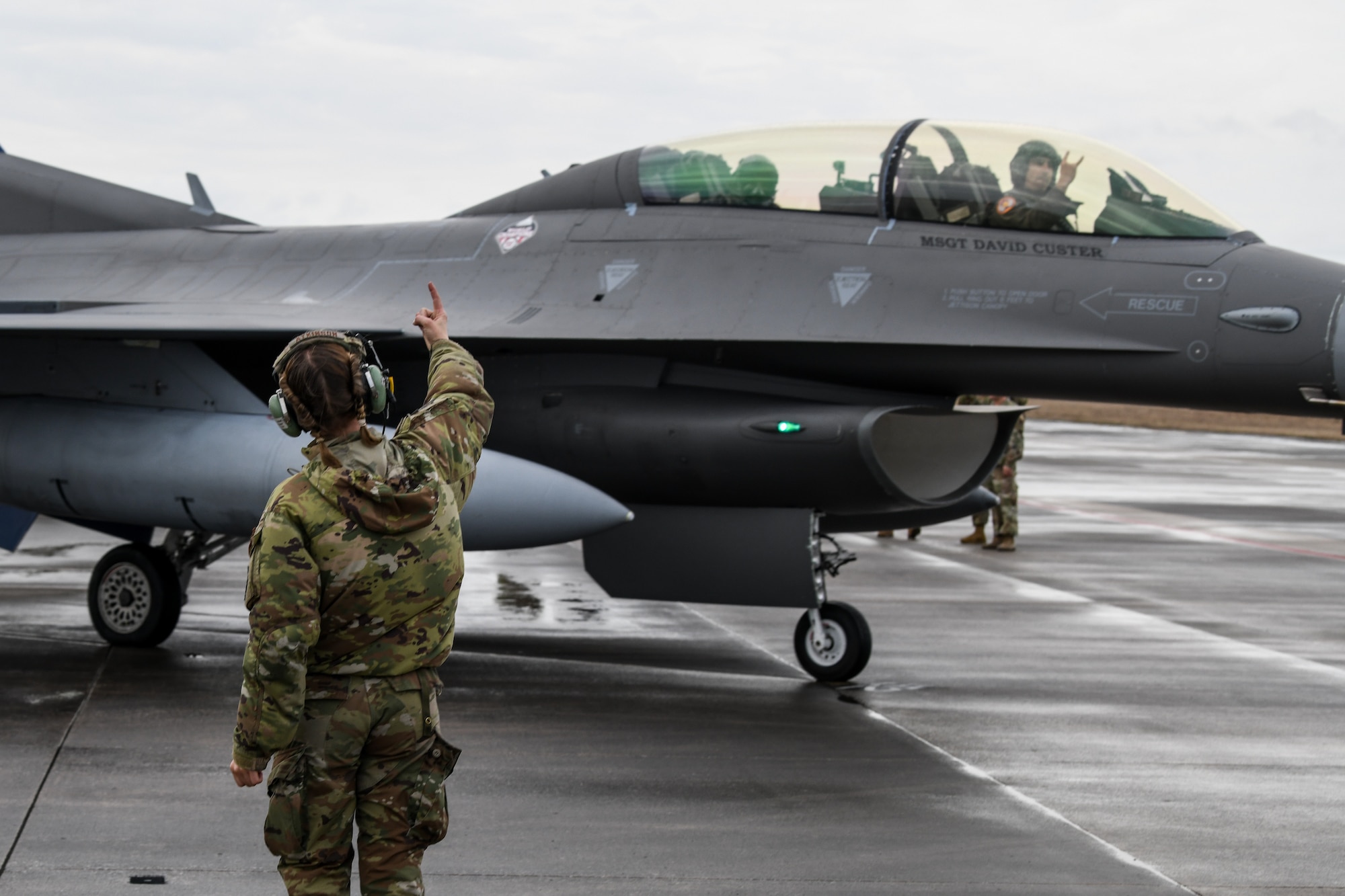 An image of U.S. Air Force Staff Sgt. Megan Atkinson, crew chief with the 177th Fighter Wing of the New Jersey Air National Guard, marshaling an F-16D Fighting Falcon before launch at Tyndall Air Force Base, Fla.