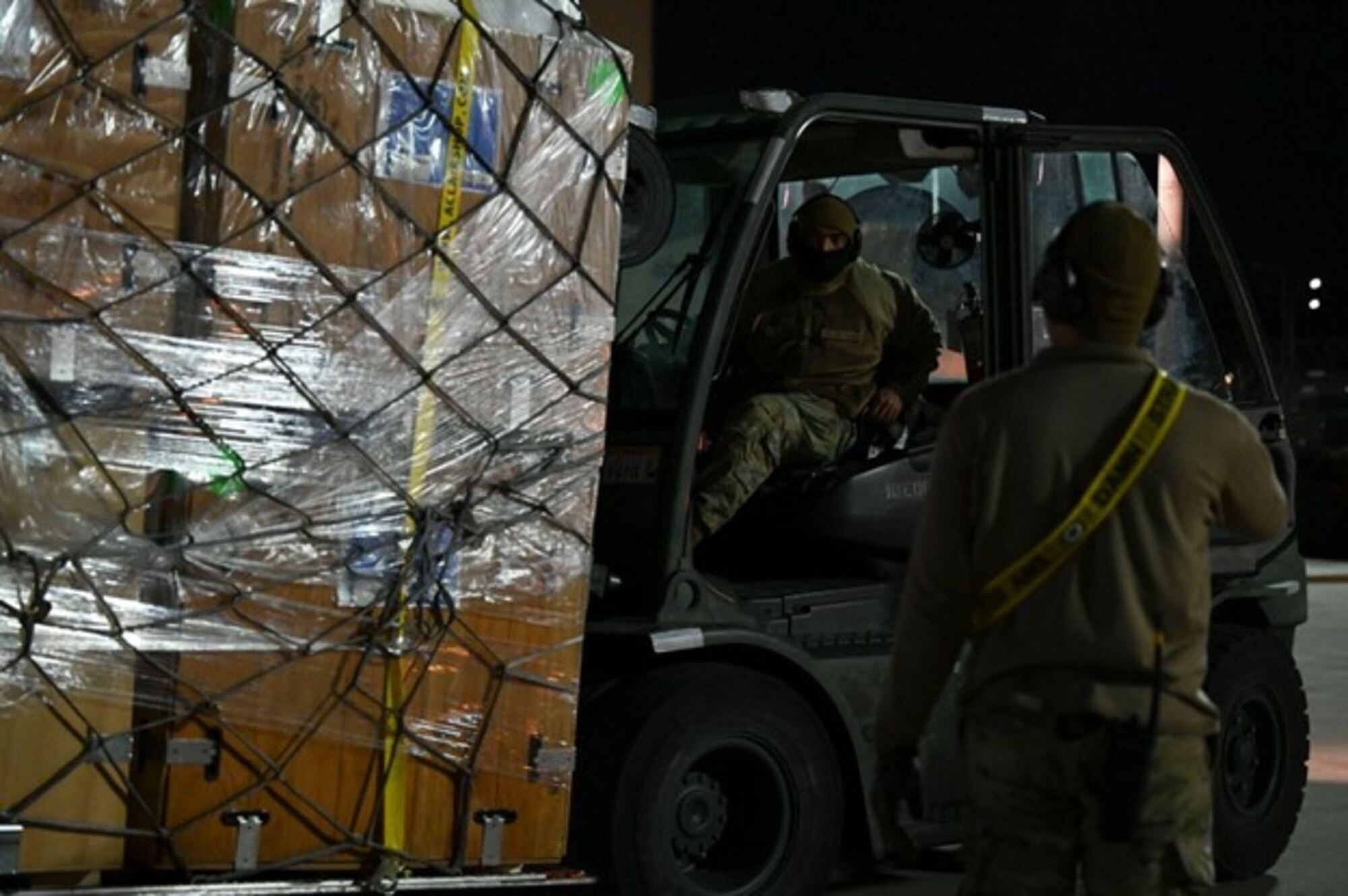 Senior Airman Troy Boyce, a passenger service specialist assigned to the 728th Air Mobility Squadron, assists humanitarian relief volunteers with offloading a chartered 747-400F containing a 52-bed emergency field hospital tent from U.S. non-government organization Samaritan's Purse at Incirlik Air Base, Türkiye, Feb. 10, 2023. The hospital components will be transported commercially to Antakya, Türkiye to give aid to those in need following the earthquakes that struck Türkiye on Feb. 6. The U.S. military is working in support of U.S. Agency for International Development, the government of Türkiye and our Allies and partners to provide relief to the people of Türkiye. The 39th Air Base Wing is committed to facilitating disaster relief operations to rapidly reduce the suffering of the victims of this disaster. (U.S. Air Force photo by Staff Sgt. Gabrielle Winn)