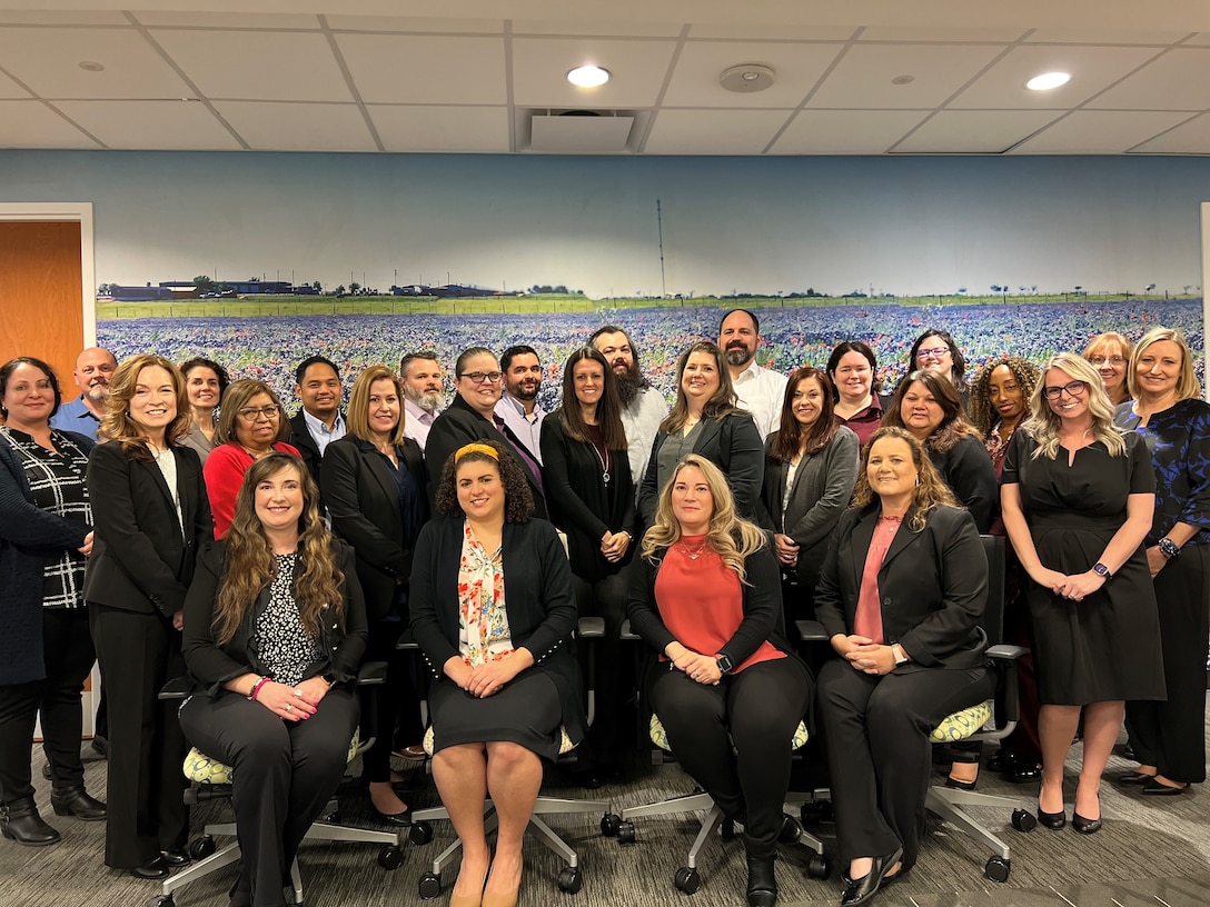 group of men and women in business attire