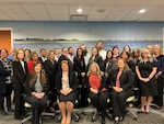 group of men and women in business attire