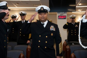 NEWPORT, R.I. (Feb. 2, 2023) Command Master Chief Baron Randle, director, U.S. Navy Senior Enlisted Academy (SEA), passes through sideboys during the SEA change of charge ceremony, Feb. 2, 2023. Command Master Chief David Martinez relieved Randle as the SEA director. The SEA provides senior enlisted leaders with education and training in communication skills, leadership and management, national security affairs, Navy programs and physical fitness. (U.S. Navy photo by Mass Communication Specialist 2nd Class Derien C. Luce)
