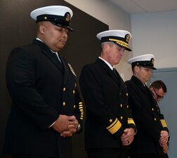 NEWPORT, R.I. (Feb. 2, 2023) From left, Command Master Chief Baron Randle, U.S. Navy Senior Enlisted Academy (SEA) director, Rear Adm. Pete Garvin, commander, Naval Education and Training Command, and Command Master Chief David Martinez, SEA deputy director, lower their heads for the invocation during the SEA change of charge ceremony, Feb. 2, 2023. Garvin presided over the ceremony as Martinez relieved Randle as the SEA director. The SEA provides senior enlisted leaders with education and training in communication skills, leadership and management, national security affairs, Navy programs and physical fitness. (U.S. Navy photo by Mass Communication Specialist 2nd Class Derien C. Luce)