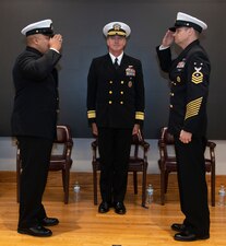 NEWPORT, R.I. (Feb. 2, 2023) Rear Adm. Pete Garvin, commander, Naval Education and Training Command, center, presides as Command Master Chief Baron Randle, left, is relieved by Command Master Chief David Martinez, right, as the U.S. Navy Senior Enlisted Academy director during a change of charge ceremony, Feb. 2, 2023. The SEA provides senior enlisted leaders with education and training in communication skills, leadership and management, national security affairs, Navy programs and physical fitness. (U.S. Navy photo by Mass Communication Specialist 2nd Class Derien C. Luce)