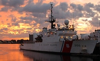 BOSTON - The 270-foot medium endurance Coast Guard Cutter Seneca sits moored at Coast Guard Integrated Support Command in Boston as the sun rises over the city May 16, 2008.