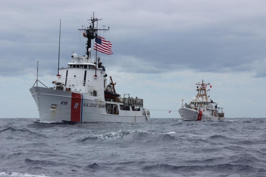The crew of the Coast Guard Cutter Active, a 210-foot Medium Endurance Cutter homeported in Port Angeles, Wash., conducts an at sea refueling of the Coast Guard Cutter Oliver Berry, a fast response cutter homeported in Honolulu, in the Eastern Pacific Ocean, Sept. 17, 2017.