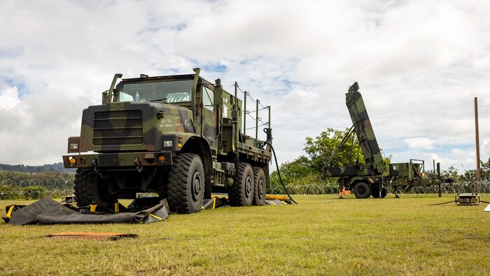 A Medium Tactical Vehicle Replacement and a Ground and Air Task Oriented Radar system are displayed on the site of an expeditionary command and control node during a training exercise at Camp H.M. Smith, Hawaii, Feb. 7, 2023. Forces from I Marine Expeditionary Force and III MEF established a Multi-Function Air Operations Center and Multi-Domain Operations Center during the exercise to synchronize all-domain effects across the Indo-Pacific region for the Joint Force and interagency partners. The C2 node, operated by Marines of MACG-38 and 3rd MAW informed and enabled the synchronization of organic, joint, and/or interagency fires – both lethal and non-lethal – across air, sea, land, space, and cyber to achieve specific, desired effects during the exercise.