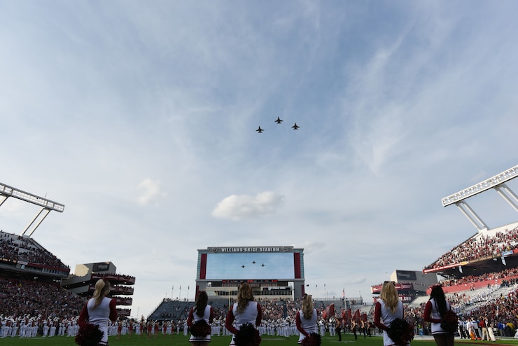 Fans and athletes alike are witness to the awesomeness of the SCANG’s advanced F-16 multi-role fighter jets as they perform today’s flyover of the University of South Carolina's Military Appreciation game against Wofford College, Nov. 18, 2017. (U.S. Air National Guard photo by Master Sgt. Jamie Scarbro)
