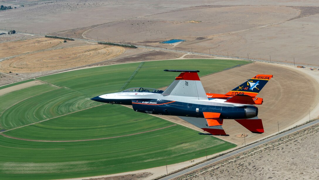 The X-62A Variable Stability In-Flight Simulator Test Aircraft, or VISTA, flies over Palmdale, Calif., Aug. 26, 2022. A joint Department of Defense team executed 12 artificial intelligence, or AI, flight tests in which AI agents piloted the X-62A VISTA to perform advanced fighter maneuvers at Edwards Air Force Base, Calif., Dec. 1-16, 2022.  (U.S. Air Force photo / Kyle Brasier)
