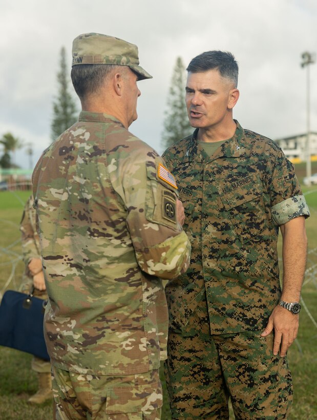 U.S. Army Gen. Charles A. Flynn, commander of U.S. Army Pacific, left, visits the expeditionary command and control (C2) node with U.S. Marine Corps Col. Jeremy S. Winters, commander of Marine Air Control Group (MACG) 38, during a training exercise at Camp H.M. Smith, Hawaii, Feb. 7, 2023. Forces from I Marine Expeditionary Force (MEF) and III MEF established a Multi-Function Air Operations Center and Multi-Domain Operations Center during the exercise to synchronize all-domain effects across the Indo-Pacific region for the Joint Force and interagency partners. The C2 node, operated by Marines of MACG-38 and 3rd MAW informed and enabled the synchronization of organic, joint, and/or interagency fires – both lethal and non-lethal – across air, sea, land, space, and cyber to achieve specific, desired effects during the exercise. (U.S. Marine Corps photo by Sgt. Sasha Pierre-Louis)