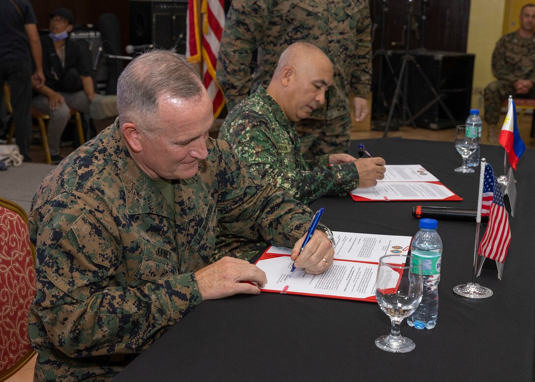 U.S. Marine Corps Lt. Gen. William M. Jurney, left, commander, U.S. Marine Corps Forces, Pacific (MARFORPAC), and Philippine Marine Corps Maj. Gen. Charlton Sean M. Gaerlan, commandant, Philippine Marine Corps (PMC), sign the official meeting minutes at the conclusion of the PMC-MARFORPAC Staff Talks, at the Citystate Asturias Hotel in Puerto Princesa, Palawan, Philippines, Feb. 10, 2023. The PMC-MARFORPAC Staff Talks serve to strengthen the relationship between MARFORPAC and the Philippine Marine Corps by providing the opportunity to align goals and objectives and collaborate on common interests through bilateral discussions and engagements. (U.S. Marine Corps photo by Sgt. Danny Nateras)