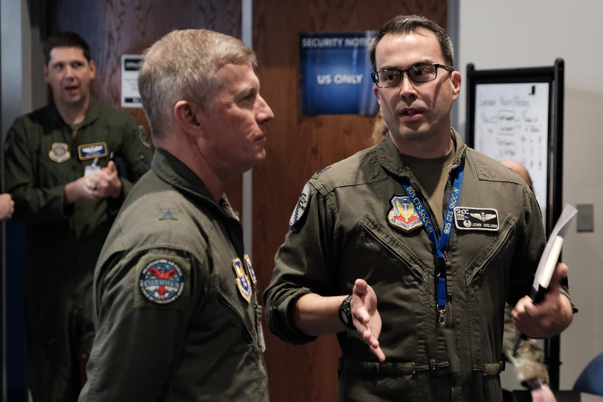 photo of U.S. Air Force military members standing and talking
