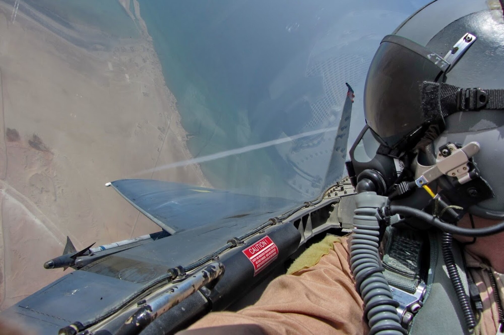 Col. Paul DeFlorio flying in an F-15 Strike Eagle above the Gulf of Aden, July 26, 2012. DeFlorio is the director of the Operational Graduate Medicine Education, or OGME, program where students are awarded flight surgeon wings and become rated aviators upon completion. The OGME program establishes a training pipeline that prepares and fields new flight doctors to support U.S. Air Force and Joint operations across the globe. (U.S. Air Force photo / Col. Paul DeFlorio)