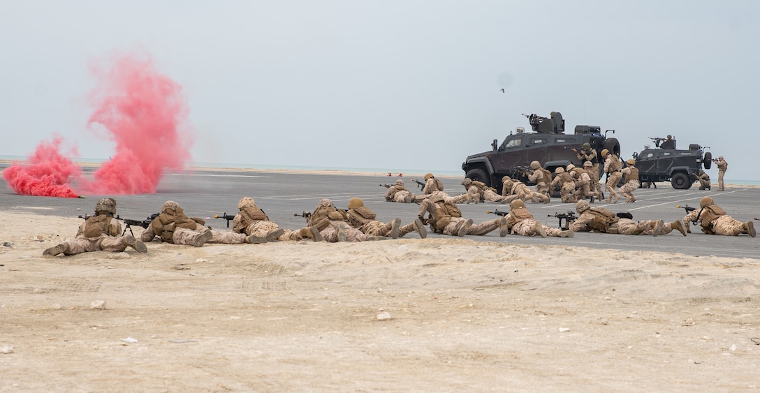 BAHRAIN (January 25, 2023) – U.S. Marines assigned to Fleet Anti-Terrorism Security Team Central Command (FASTCENT) and members of the Bahrain Defense Force engage a simulated enemy force during the Neon Defender 23 final exercise in Bahrain, Jan. 25. Neon Defender is an annual bilateral training event between U.S. Naval Forces Central Command and Bahrain. The exercise focuses on maritime security, installation defense, naval construction, medical response and search and rescue training.