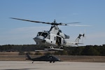 A U.S. Marine Corps UH-1Y Venom assigned to Marine Light Attack Helicopter Squadron 773 from Marine Aircraft Group 49 takes off during  a training exercise alongside an HH-60G Pave Hawk assigned to the 101st Rescue Squadron of the 106th Rescue Wing at  Francis S. Gabreski Air National Guard Base in Westhampton Beach, New York, Feb. 2, 2023. The aircraft were being used in a Forward Area Refueling Point exercise to maintain mission readiness.