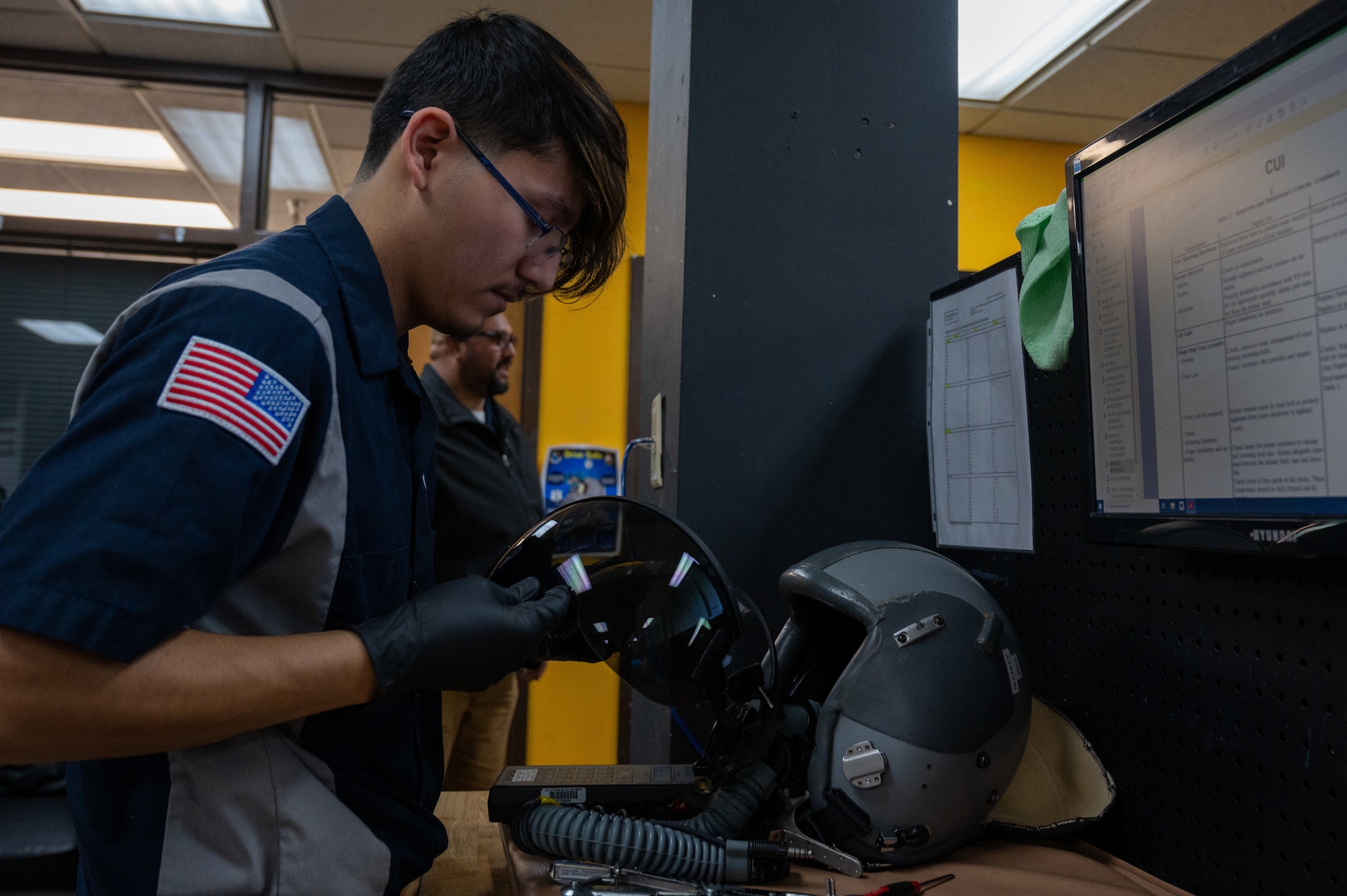 Alonzo Narvaez, a CTE Program Student, restores flight equipment and inspects it before its subsequent use on Jan. 30, 2023, at Laughlin Air Force Base, Texas. Members of the local grow our own program get the opportunity to work in various workstations on base. (U.S. Air Force photo by Senior Airman David Phaff)