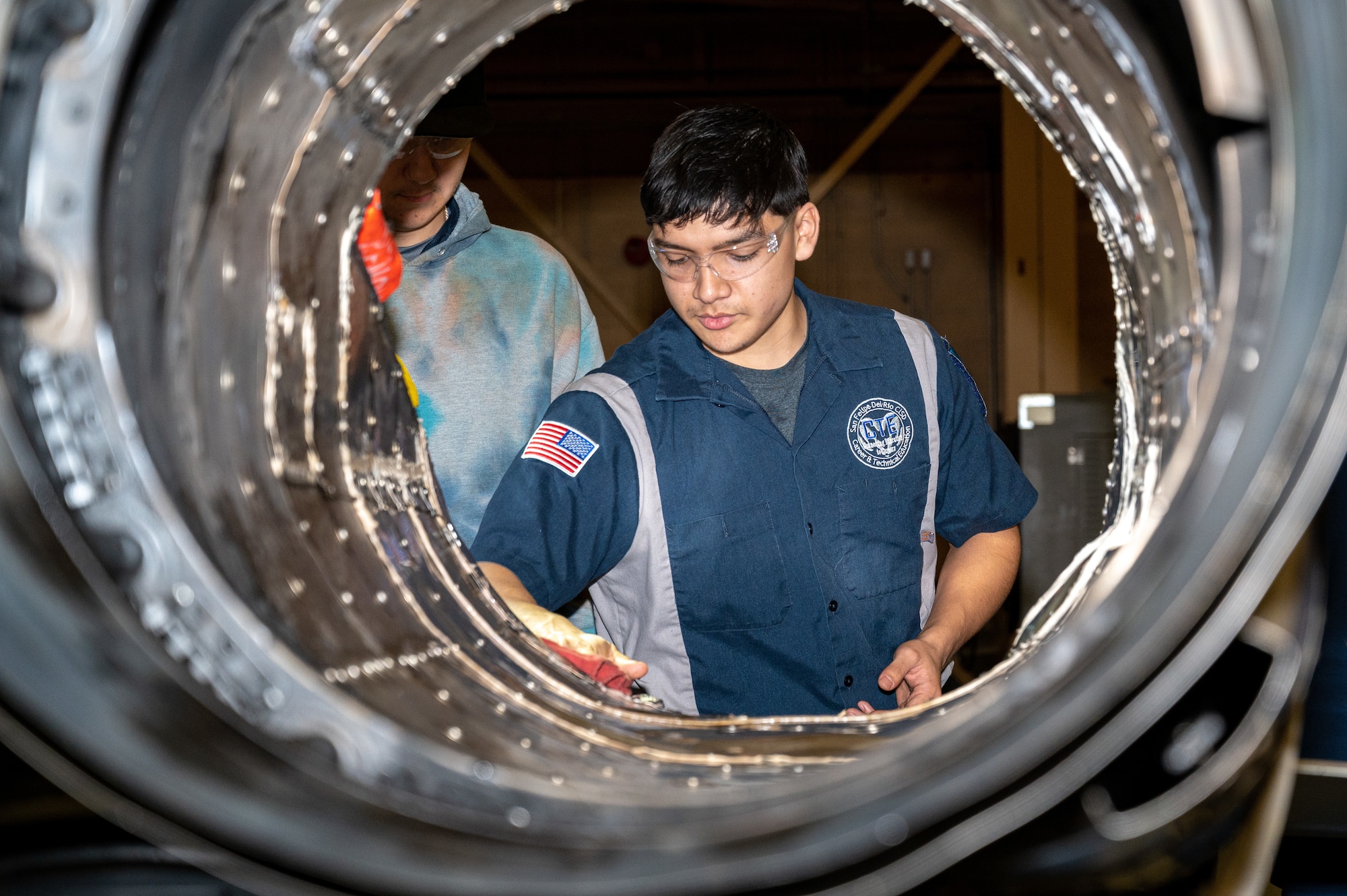 Adrian Garcia, a CTE Program Student, receives instruction from Laughlin Air Force Base, Texas, maintenance team while working on a T-38C Talon. The purpose of the Grow Our Own program is to give high school students experiences and tools to set them up for success in their adult lives. (U.S. Air Force photo by Senior Airman David Phaff)