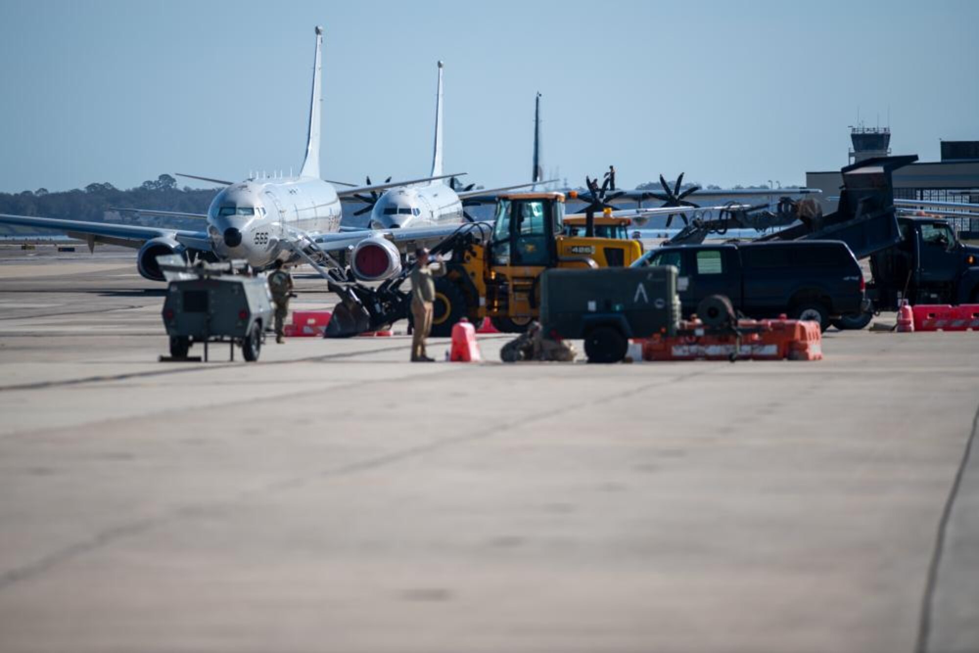 U.S. Air Force Airmen of the 202nd RED HORSE Squadron, Florida Air National Guard, repair the airfield ramp at Naval Air Station Jacksonville, Florida, Feb. 8, 2023. The Airmen are rehabbing the airfield to ensure taxiway concrete can withstand the weight of the U.S. Navy's P-8A Poseidon aircraft.(U.S. Air National Guard photo by Senior Airman Jacob Hancock)