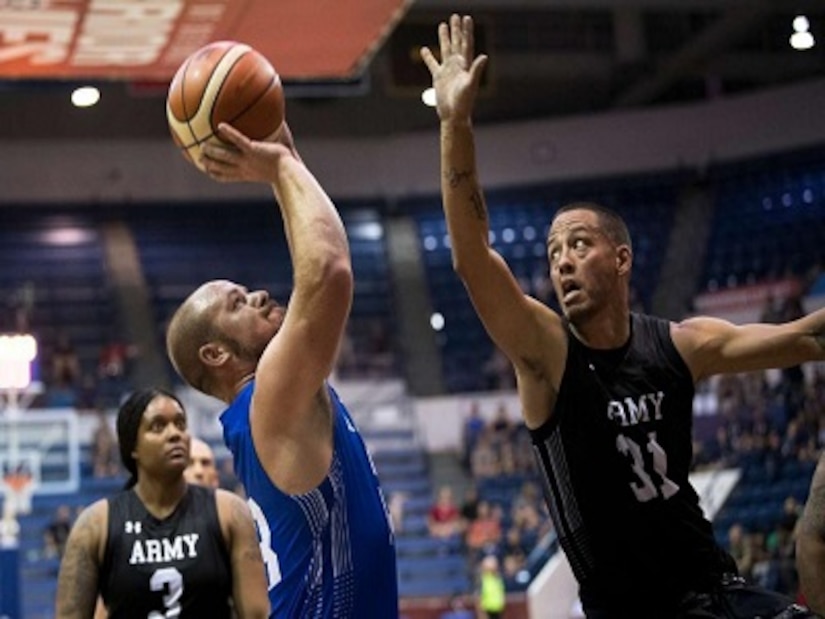 Army Specialist (R) Anthony Farve plays wheelchair basketball on Team Army at the 2018 Department of Defense Warrior Games in Colorado Springs.